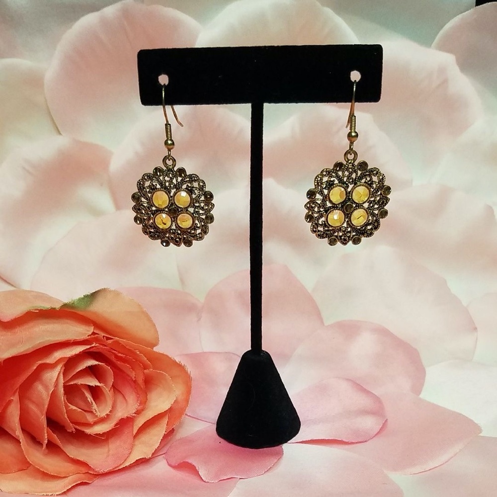 Premier Designs gold toned earrings with stones.